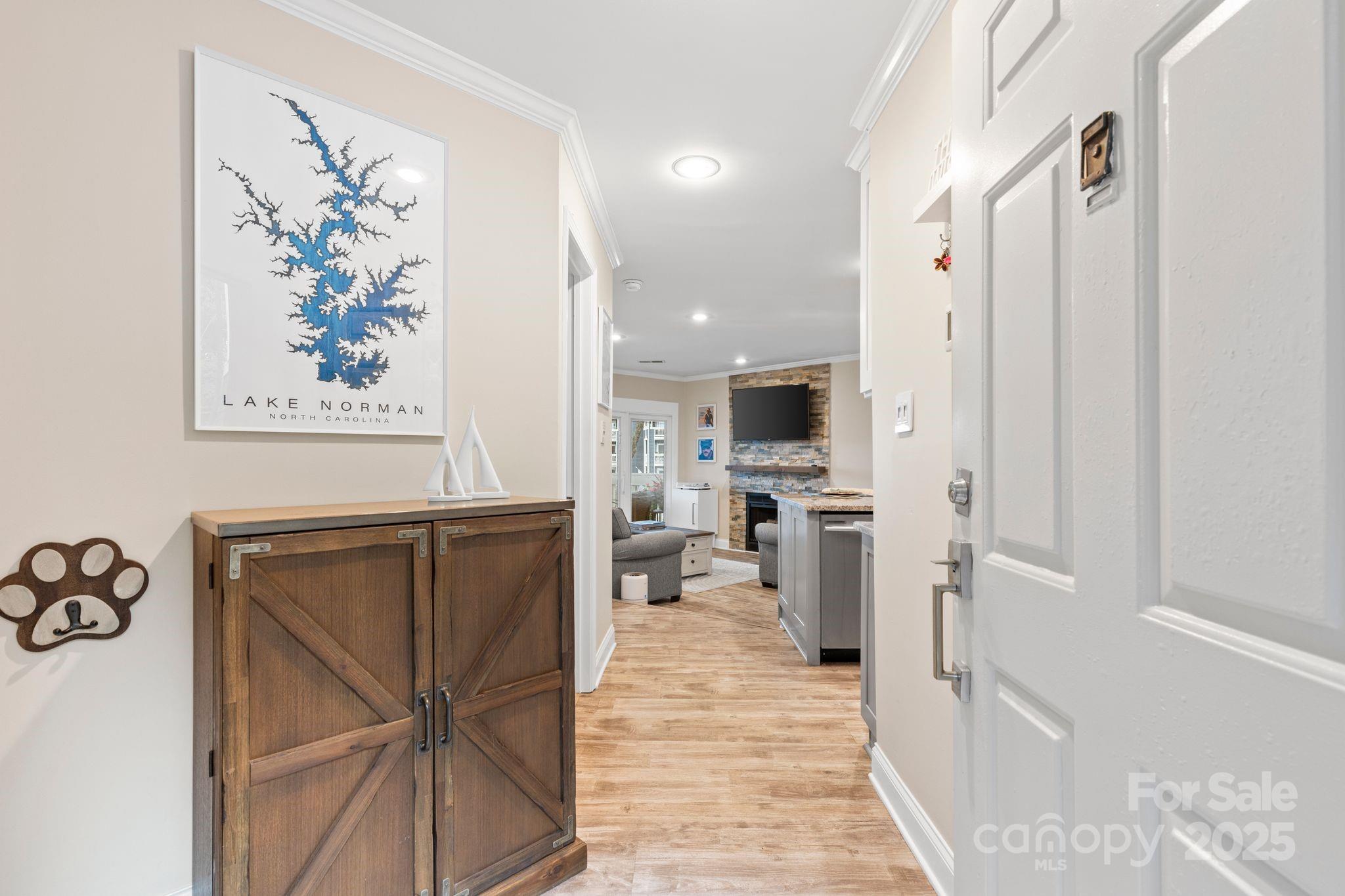 2121 Regatta Lane, Unit 209 Denver, NC 28037 - Photo 5 of 40 a view of kitchen with furniture and wooden floor