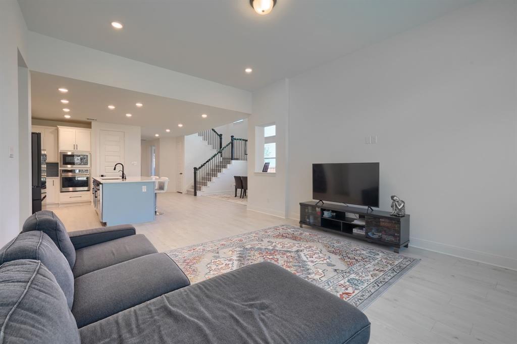 1348 Bay Laurel Road Fate, TX 75087 - Photo 14 of 35 a living room with furniture and a flat screen tv
