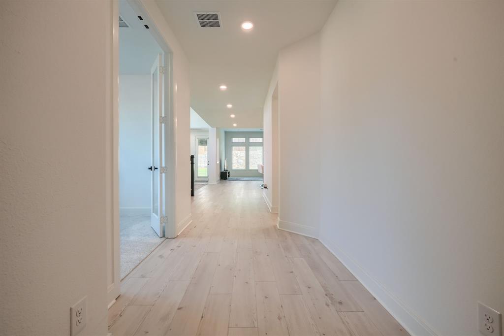1348 Bay Laurel Road Fate, TX 75087 - Photo 21 of 35 a view of a hallway with wooden floor