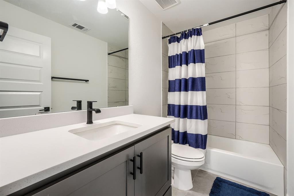 1348 Bay Laurel Road Fate, TX 75087 - Photo 28 of 35 a bathroom with a sink a toilet and shower