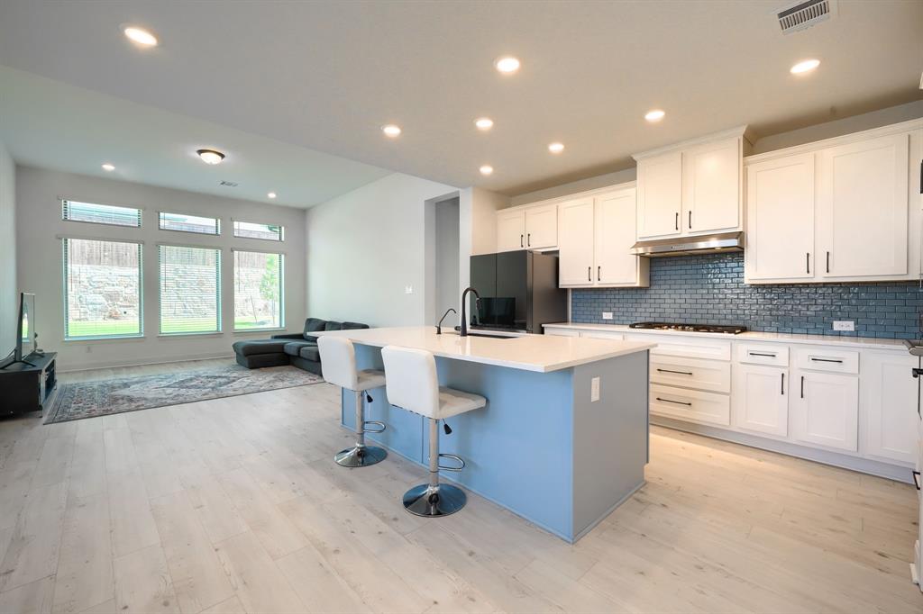 1348 Bay Laurel Road Fate, TX 75087 - Photo 8 of 35 a kitchen with sink cabinets and window