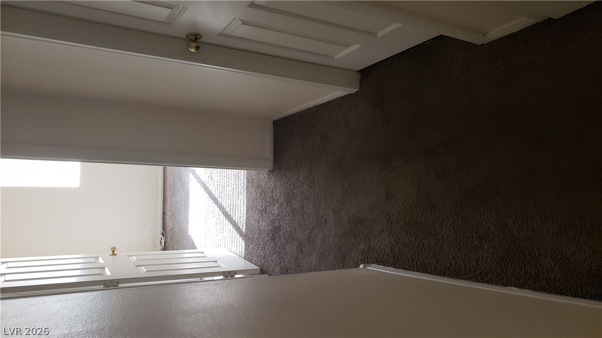 9112 Manalang Road Las Vegas, NV 89123 - Photo 39 of 50 A well-maintained hallway with plush carpeting provides a welcoming transition between rooms.