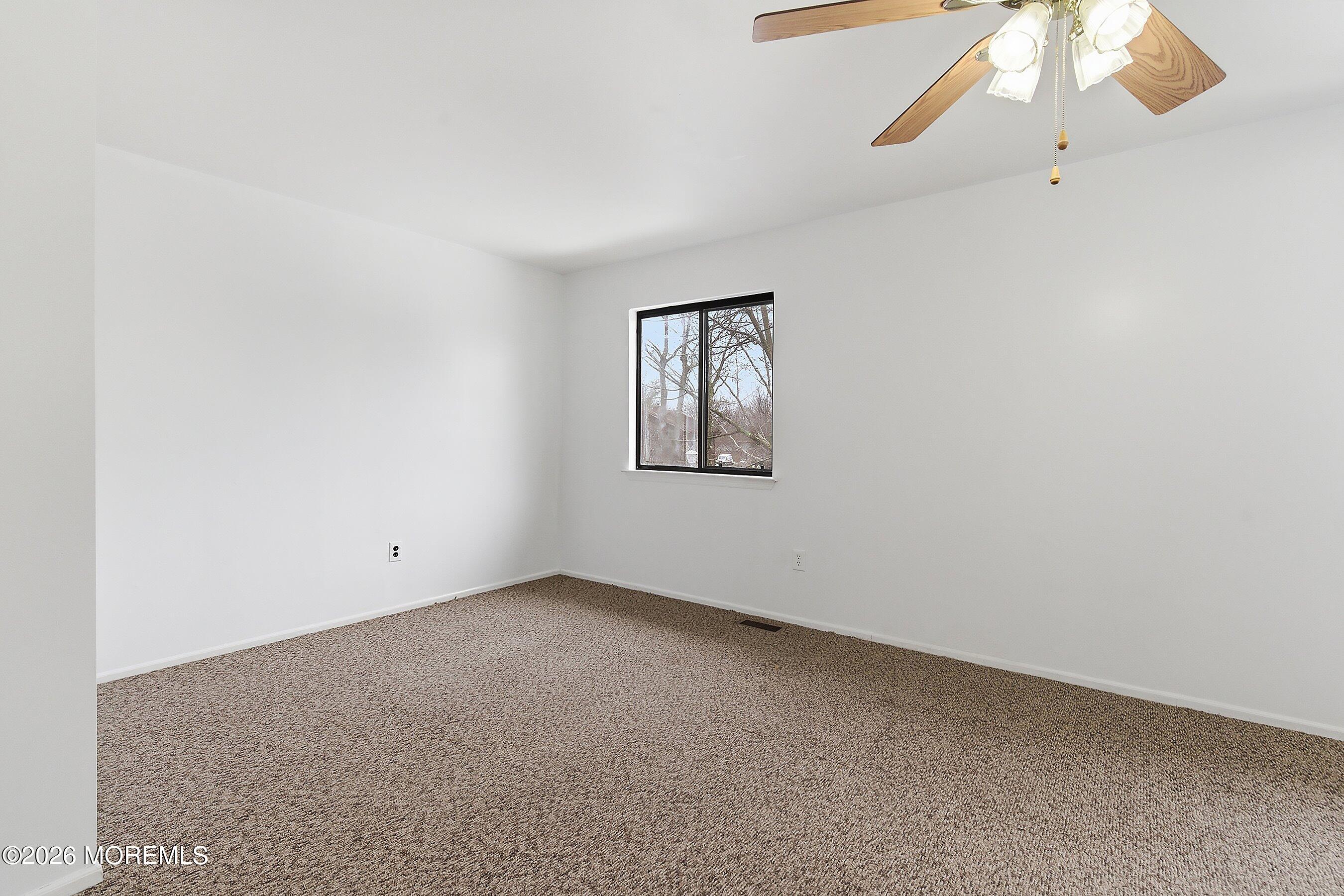11 Owl Road Howell, NJ 07731 - Photo 17 of 48 an empty room with a window