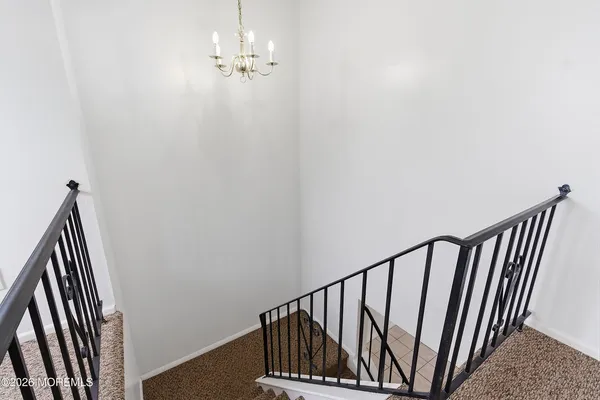 a view of a staircase with wooden floor