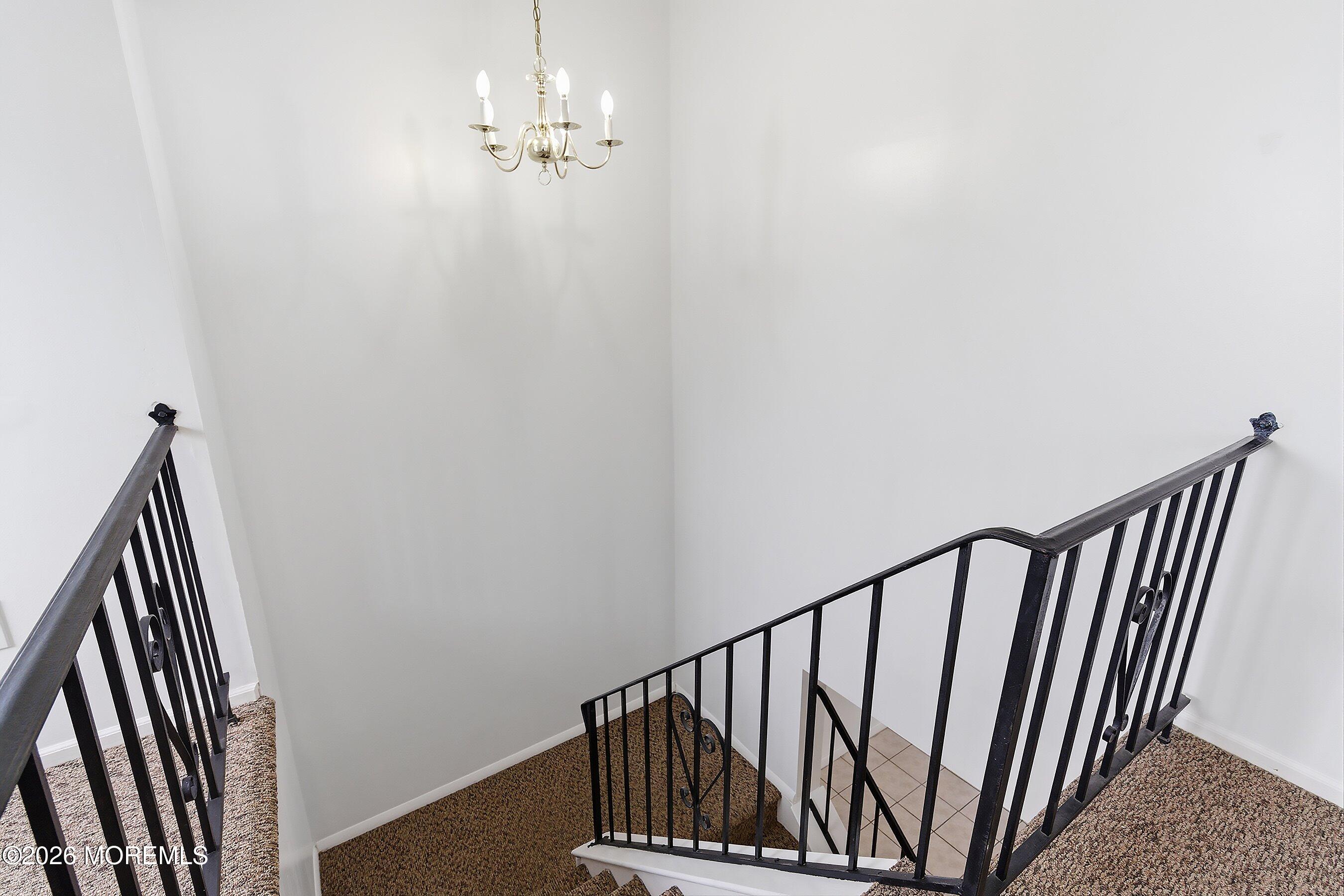 11 Owl Road Howell, NJ 07731 - Photo 20 of 48 a view of a staircase with wooden floor