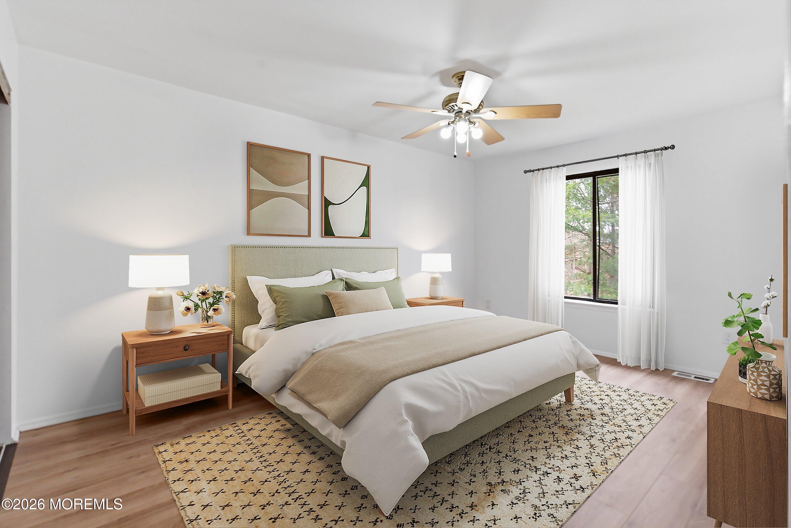 11 Owl Road Howell, NJ 07731 - Photo 23 of 48 a bedroom with a bed and a chandelier