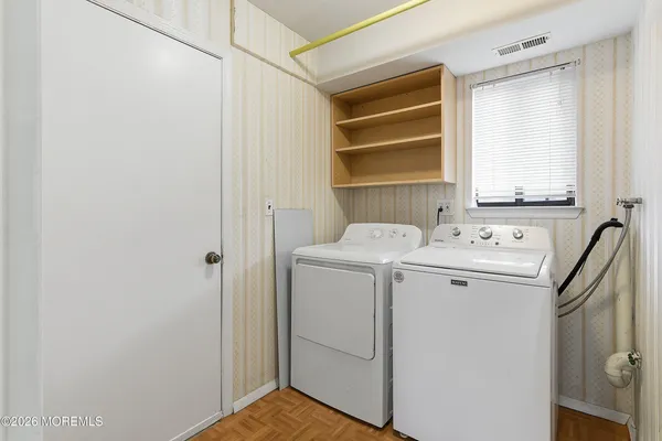a utility room with dryer and washer