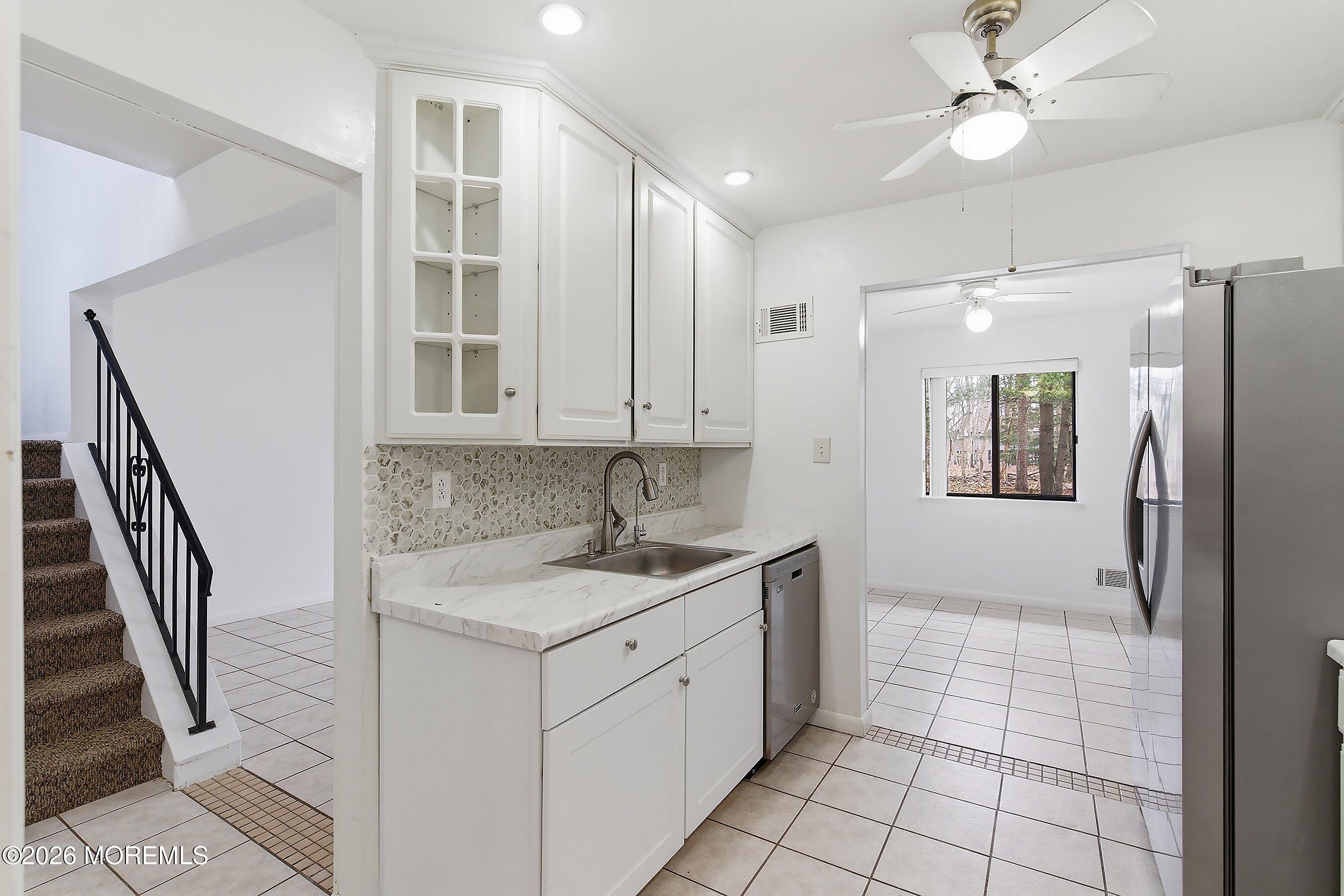 11 Owl Road Howell, NJ 07731 - Photo 28 of 48 a bathroom with a sink a toilet and a mirror