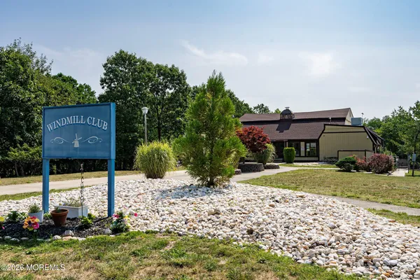 a view of house with outdoor space and swimming pool
