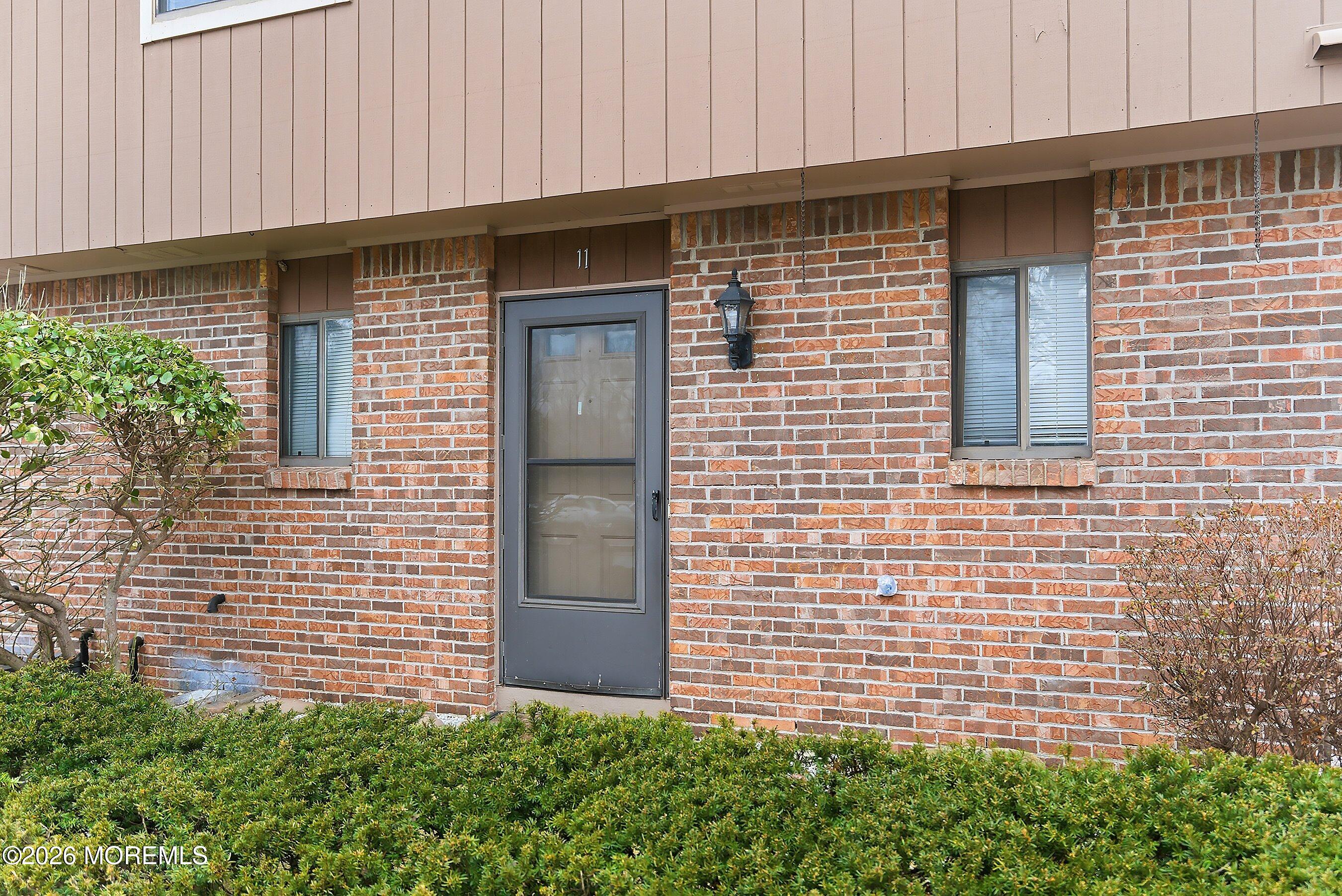 11 Owl Road Howell, NJ 07731 - Photo 3 of 48 a brick house with a outdoor space