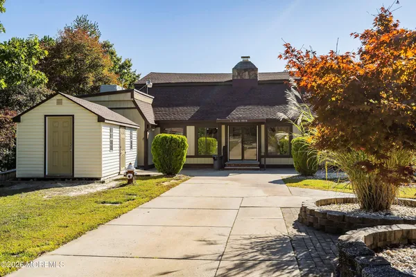 a room with pool table and windows
