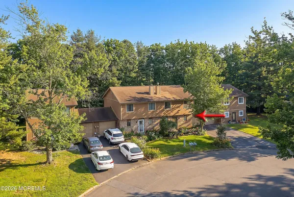 a front view of a house with garage