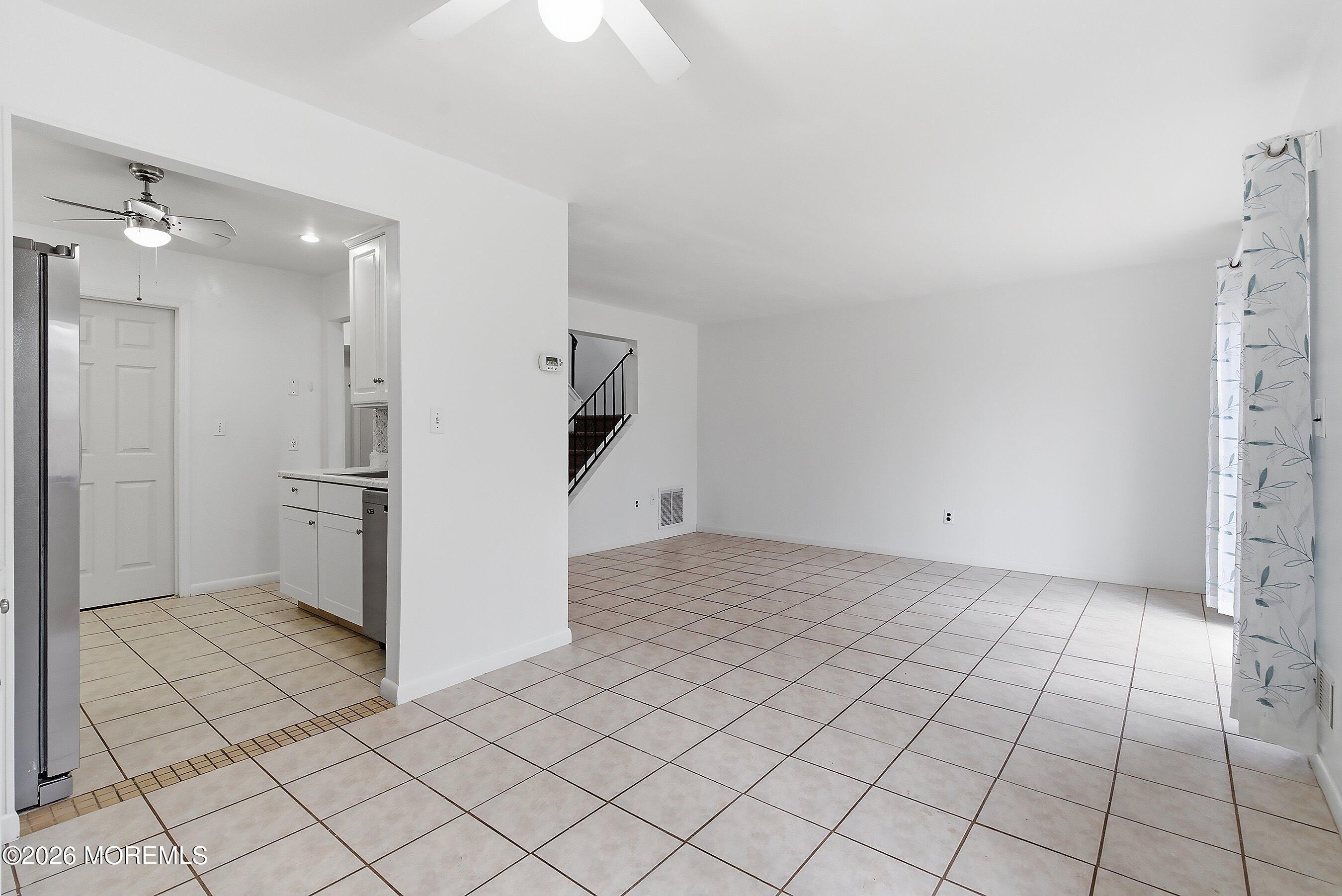 11 Owl Road Howell, NJ 07731 - Photo 7 of 48 a view of a refrigerator and window in a room