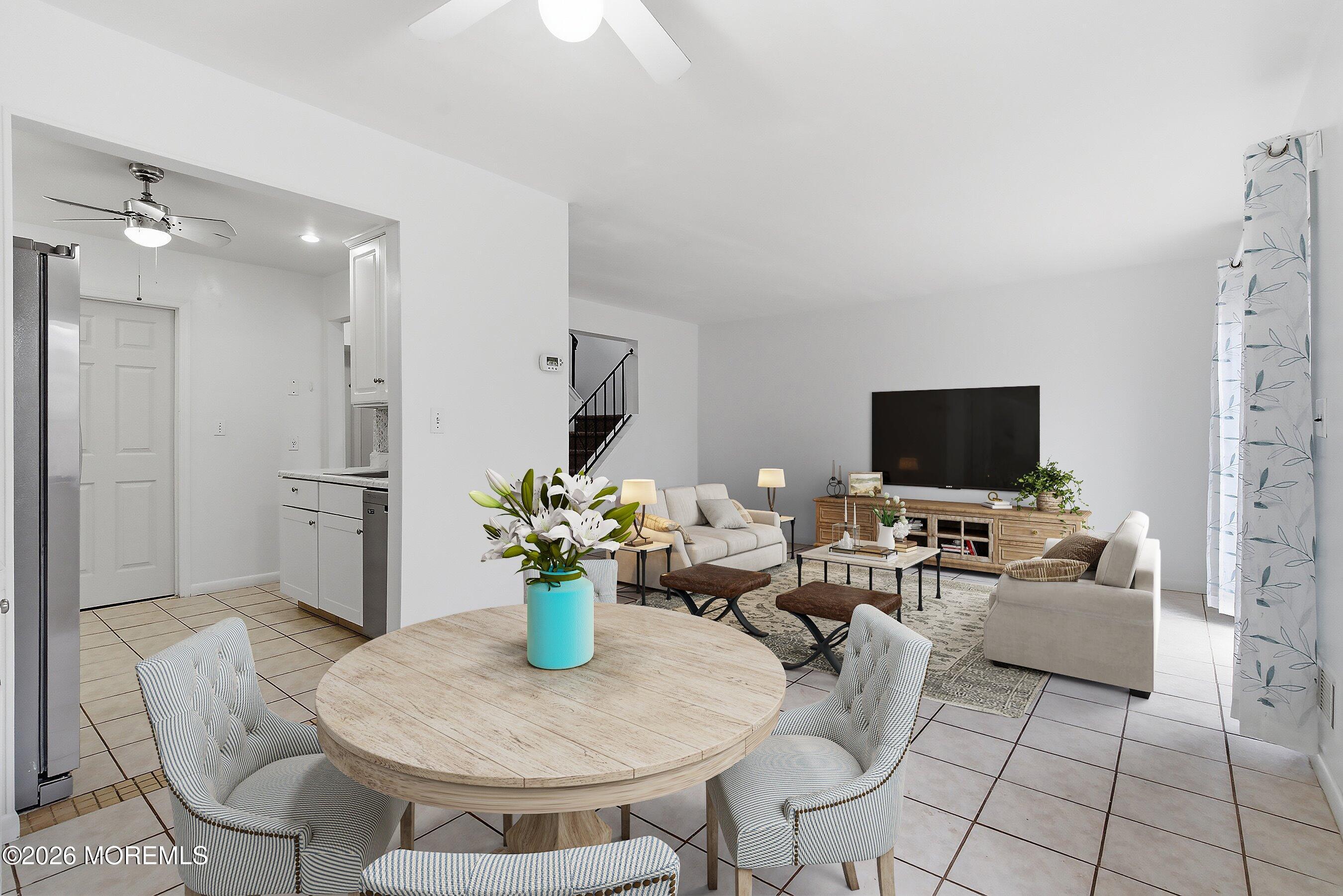 11 Owl Road Howell, NJ 07731 - Photo 8 of 48 a living room with furniture a flat screen tv and a refrigerator