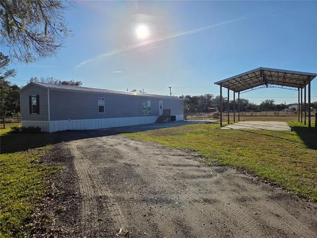 a view of a room with a table and chairs