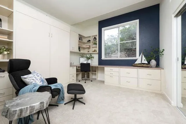 a room with furniture and a mirror