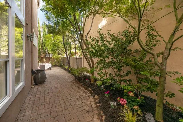 a backyard of a house with fire pit and furniture