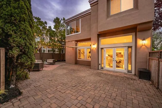 a backyard of a house with yard fire pit and outdoor seating