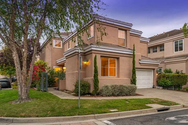 a view of a swimming pool and lounge chairs