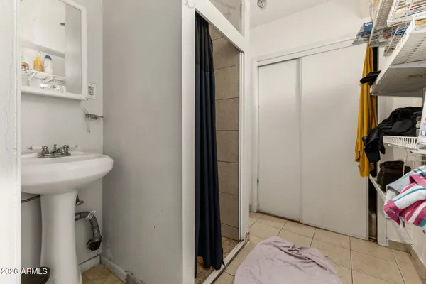 a bathroom with a sink and a mirror