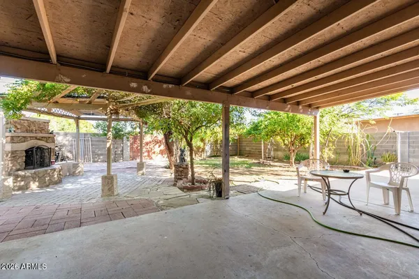 a view of a patio with a table chairs and a patio