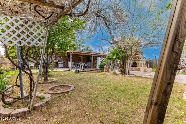 a view of house with backyard