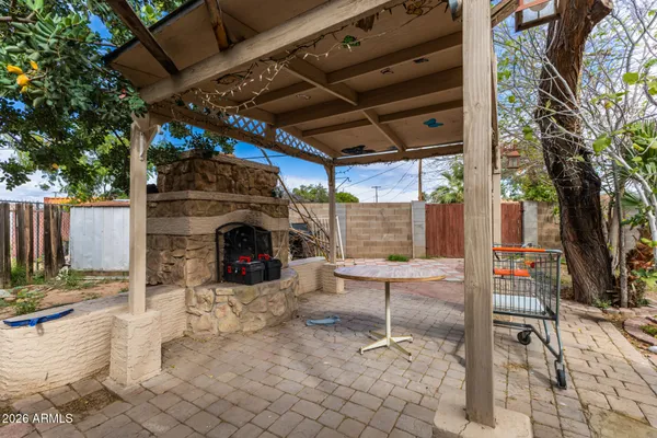 a view of a chairs and fire pit in the patio