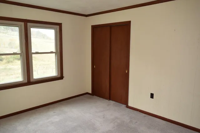 an empty room with walk in closet