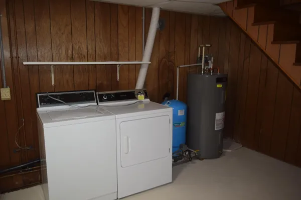 a view of storage and utility room with empty racks