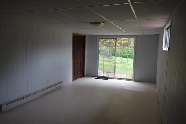 a view of hallway with stairs and furniture