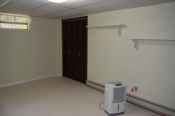 a view of a wooden house with a yard