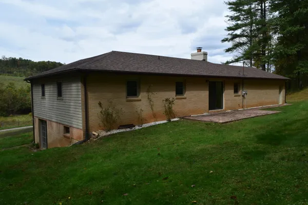 a backyard of a house with lots of green space