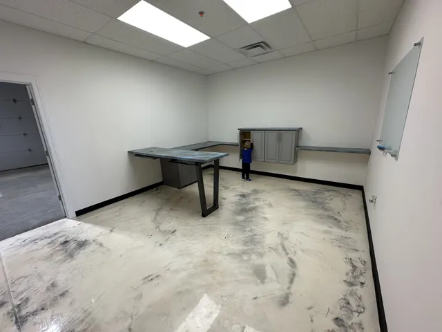 a view of room with table and chair