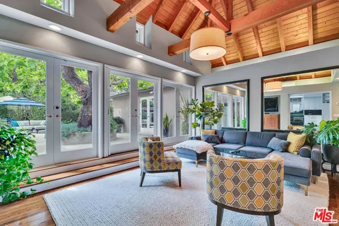 a kitchen with granite countertop a stove sink and cabinets