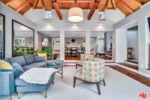 a kitchen with granite countertop cabinets and white stainless steel appliances