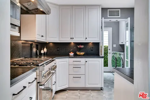 a bed room with a bed and a potted plant