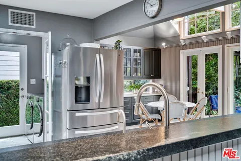 a bedroom with a large bed and a large window