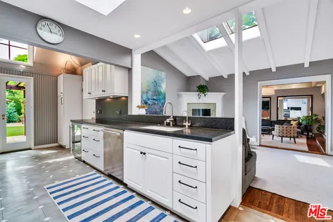 a bathroom with granite countertop granite countertop a sink and a window