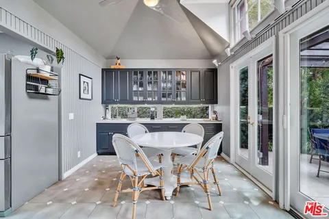 a bathroom with a tub a sink and a shower curtain