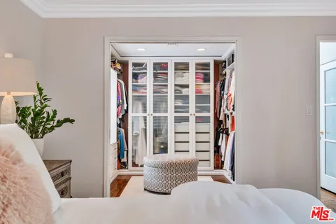a bathroom with a granite countertop sink vanity and mirror