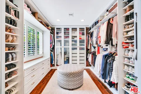 a view of a patio with a table chairs and a couple of chairs