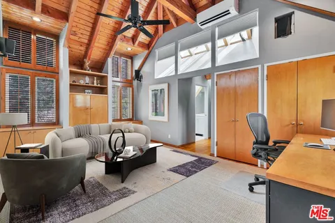 a view of a chairs and table in the garden