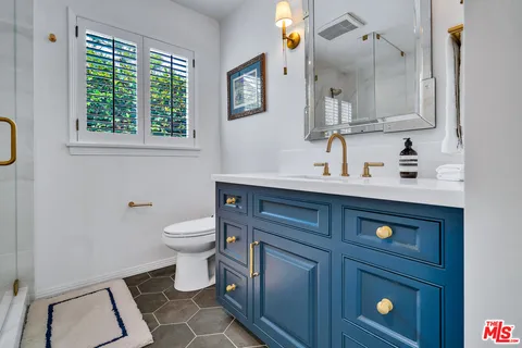 a view of a house with a tree