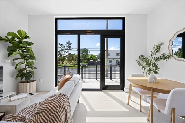 a bedroom with a bed and a potted plant