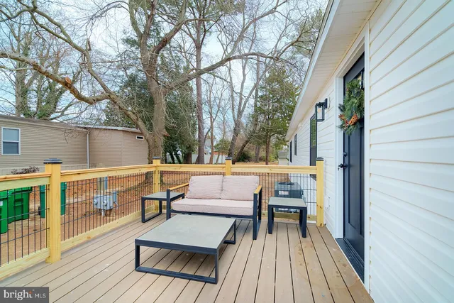 a view of roof deck with seating area