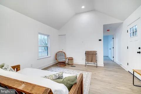 a bedroom with bed and a window