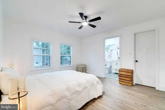 a spacious bedroom with a bed and window