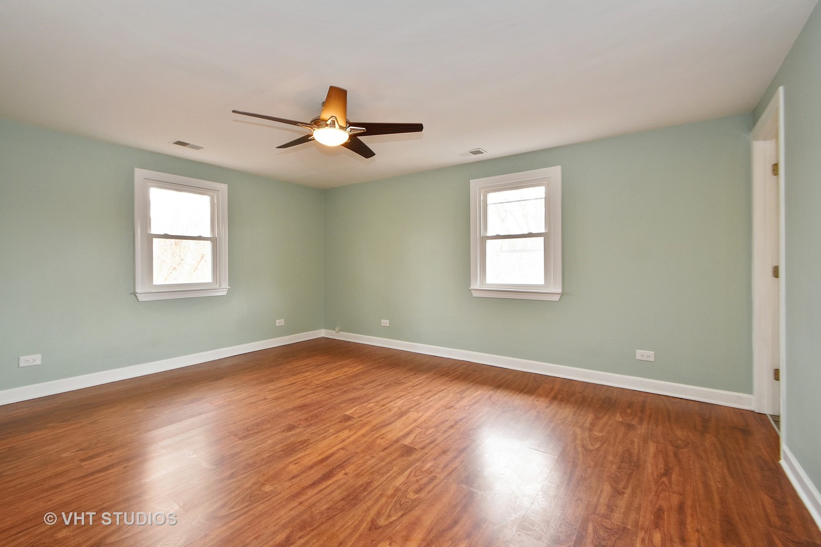 14301 Ridgeway Avenue Midlothian, IL 60445 - Photo 8 of 10 a view of empty room with wooden floor and fan
