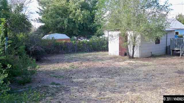 721 Balzar Circle Reno, NV 89502 - Photo 13 of 13 a view of a backyard with large trees and plants