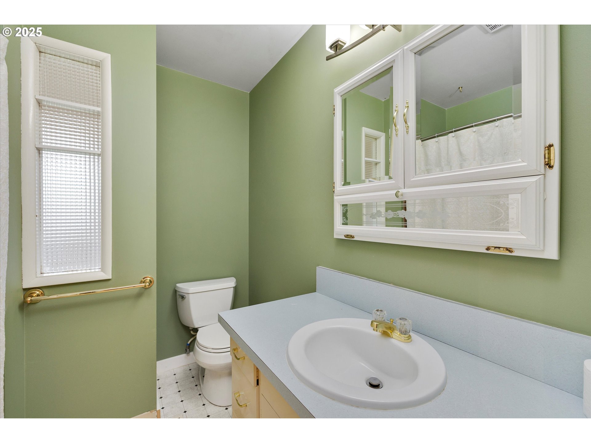 1360 Northwest 130th Avenue Portland, OR 97229 - Photo 18 of 36 a bathroom with a sink a toilet and mirror
